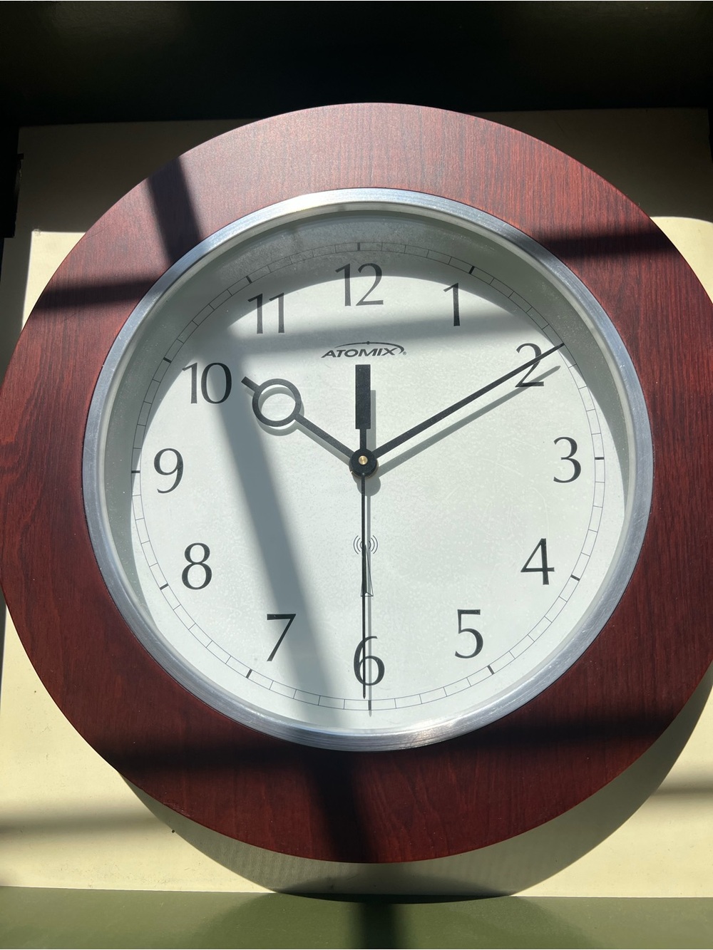 Classic Wood-Frame Wall Clock in Brown and White